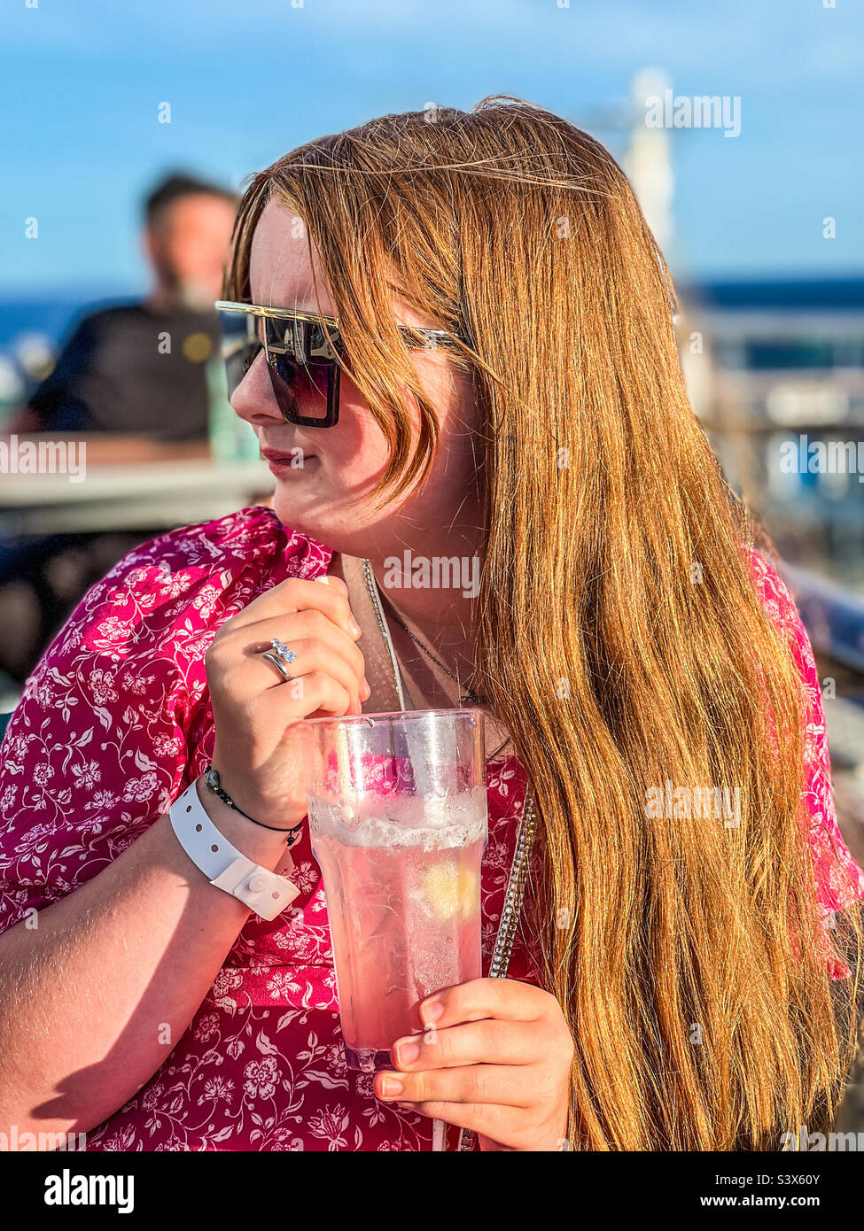 Young woman holding glass of lemonade Stock Photo