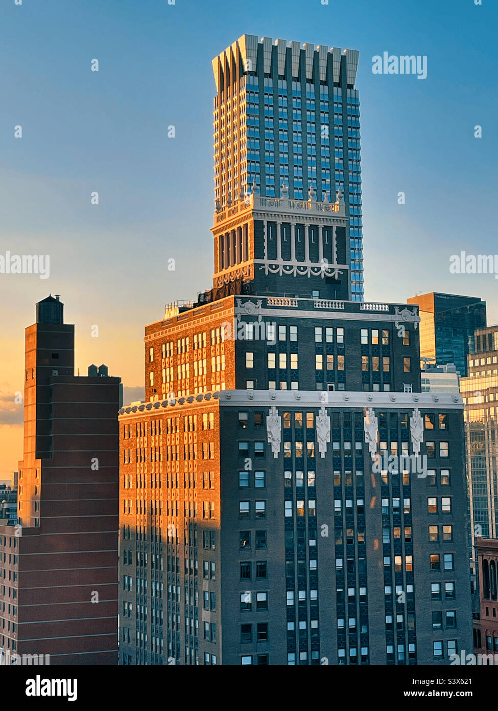 Contrasting architectural styles of 200 Madison Ave. and the ultra modern Langham Hotel in Midtown Manhattan, 2022, New York City, USA - Smartphone Captured Stock Image