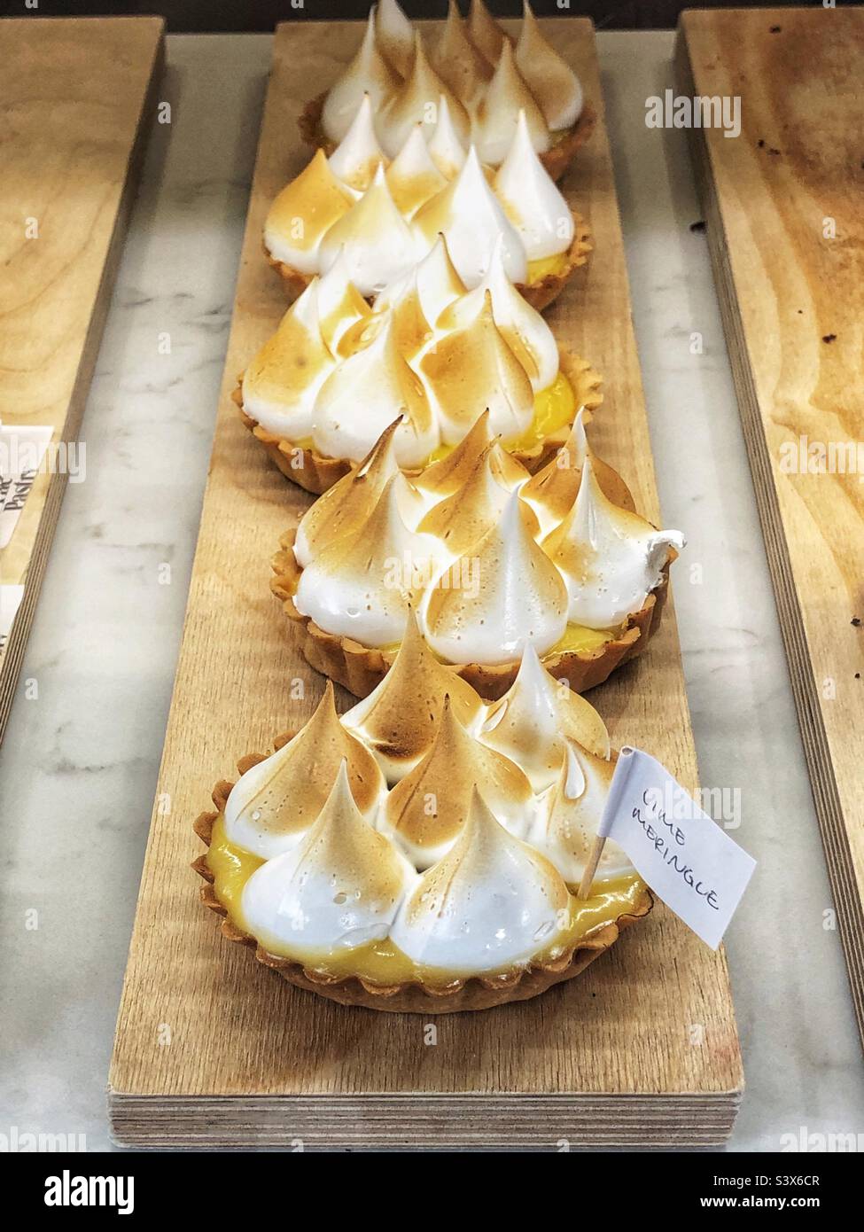 Lime Meringue in bakery shop window Stock Photo Alamy
