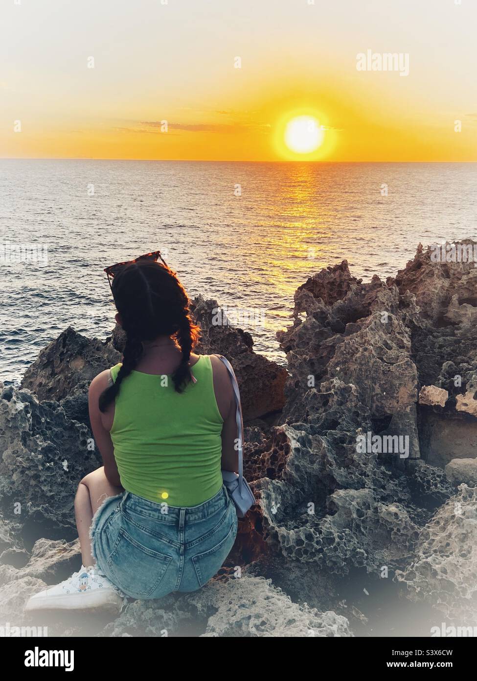 Girl watching sunset hi-res stock photography and images - Alamy