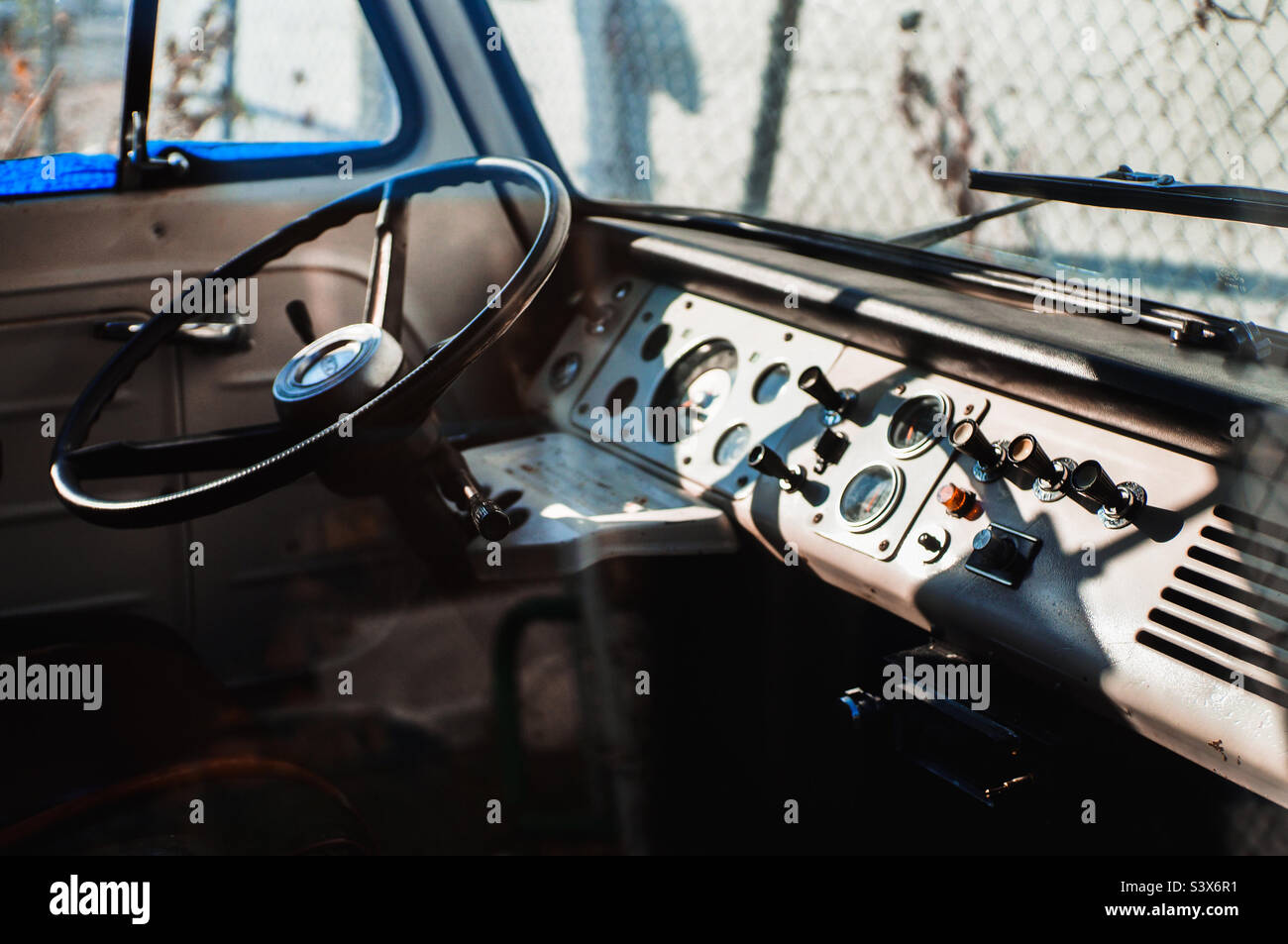 Front panel and steering wheel of a classic 1960’s Ford Econoline Van. - Smartphone Captured Stock Image