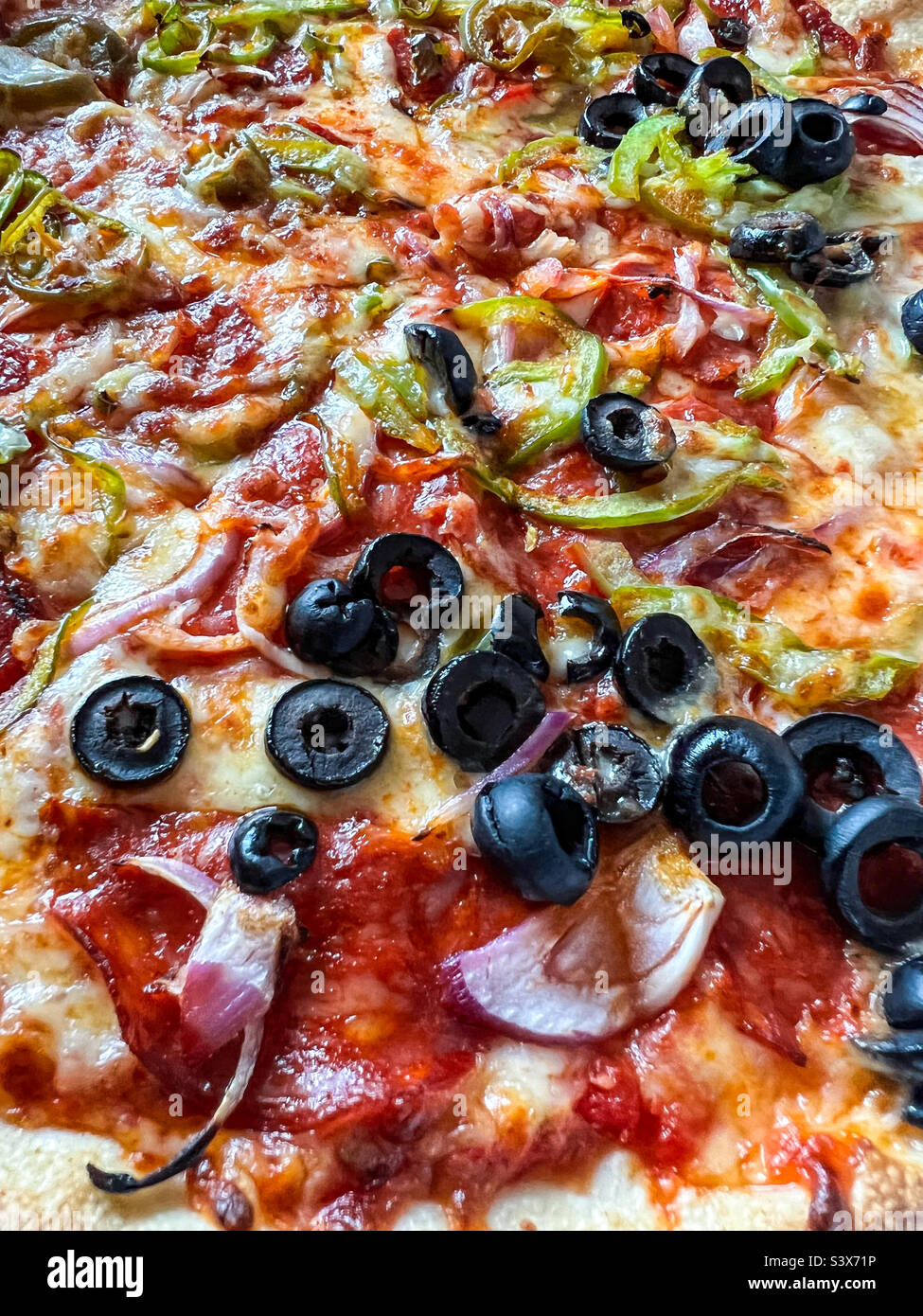 Veggie pizza with black olives Stock Photo