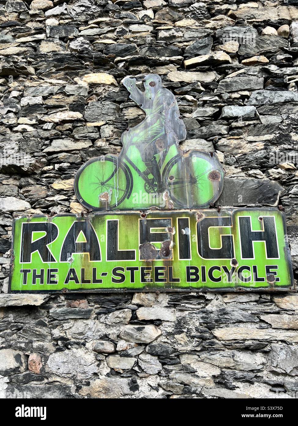 Old metal sign advertising Raleigh bicycles Stock Photo
