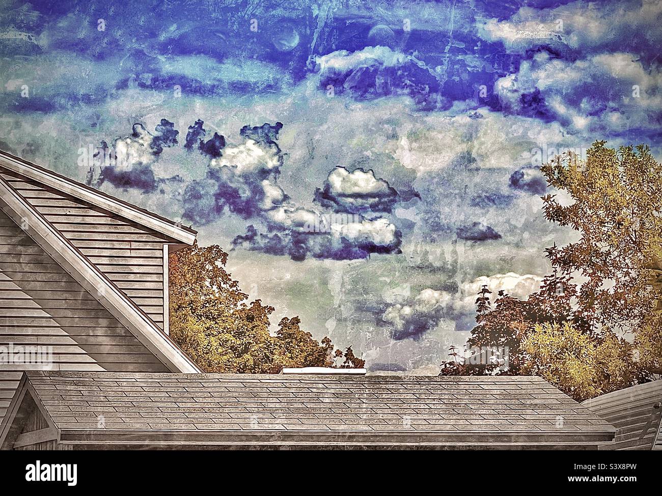 A grungy rendition of the beauty of Mother Nature that surrounds us, the trees, sky and clouds, framed here by the man made, the rooftops, eaves and walls of our homes. Stock Photo