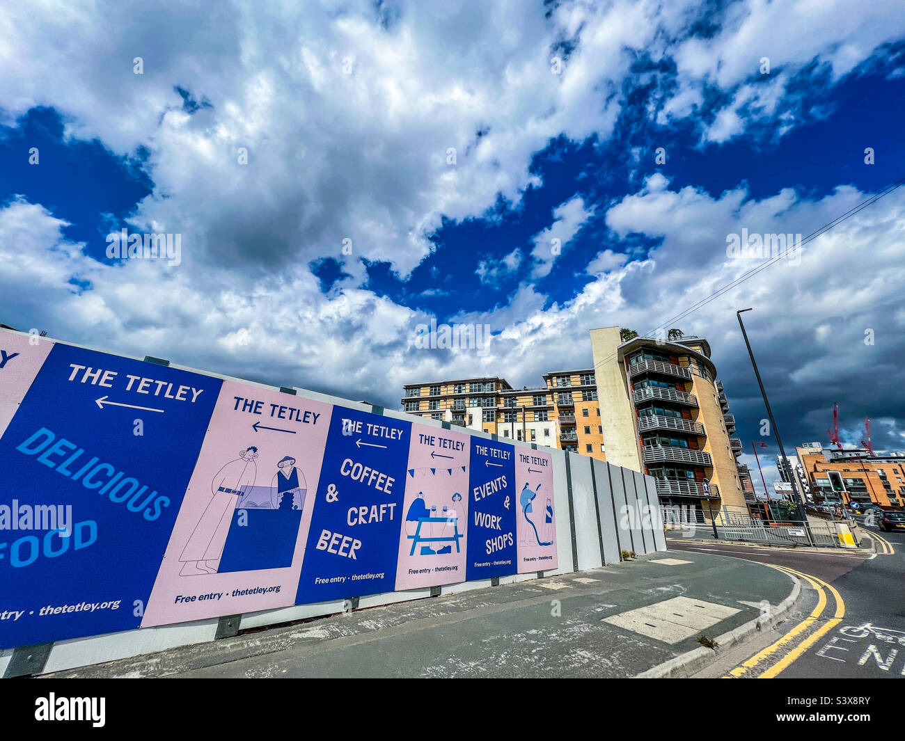 Hoarding boards covering new construction developments on crown point Road in Leeds city centre - Smartphone Captured Stock Image