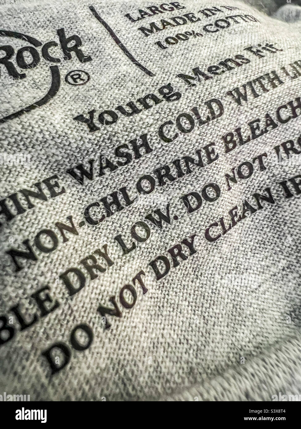 Washing instructions inside men’s t shirt Stock Photo