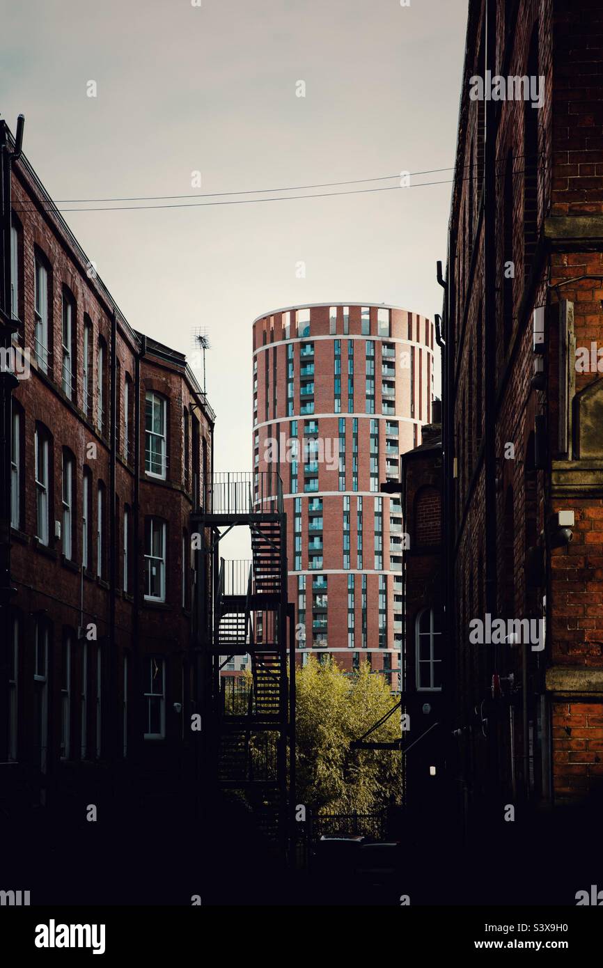 The modern and ancient architecture of Leeds living side-by-side with candle house prominent - Smartphone Captured Stock Image