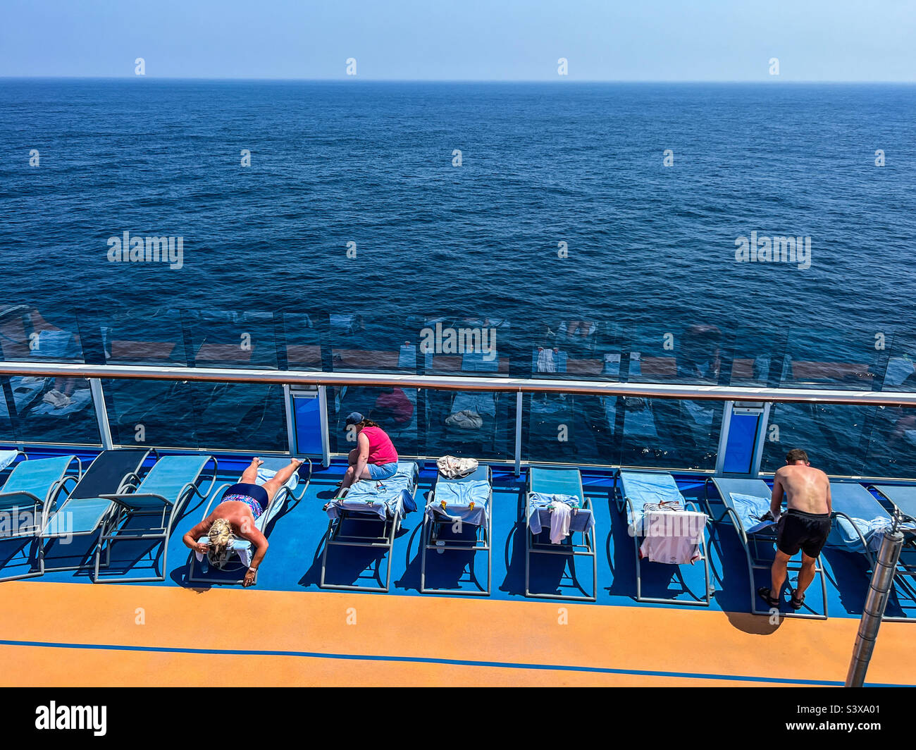 Sunbathing on a cruise ship in summer on the Alboran sea in the Mediterranean - Smartphone Captured Stock Image