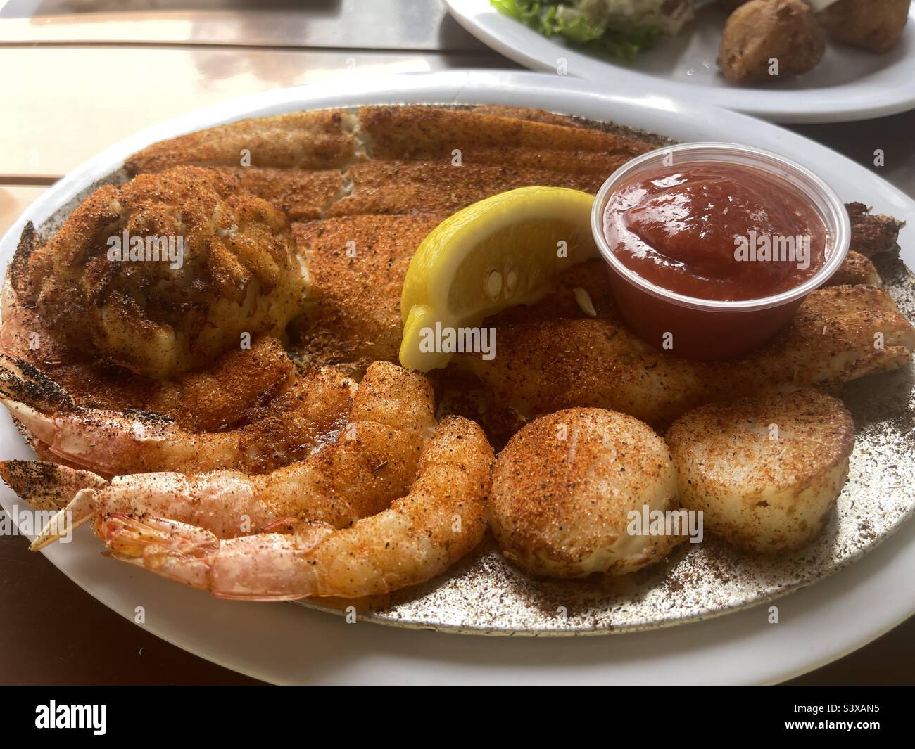 Seafood platter with shrimp,scallops, crabcake, blackened fish Stock Photo Alamy