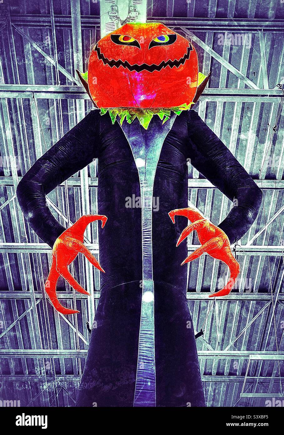 Stores gearing up for the upcoming Halloween season with aisles filled with holiday decor, costumes, candy, etc. Big inflated decor draws the customer’s attention to the products and items they need. - Smartphone Captured Stock Image