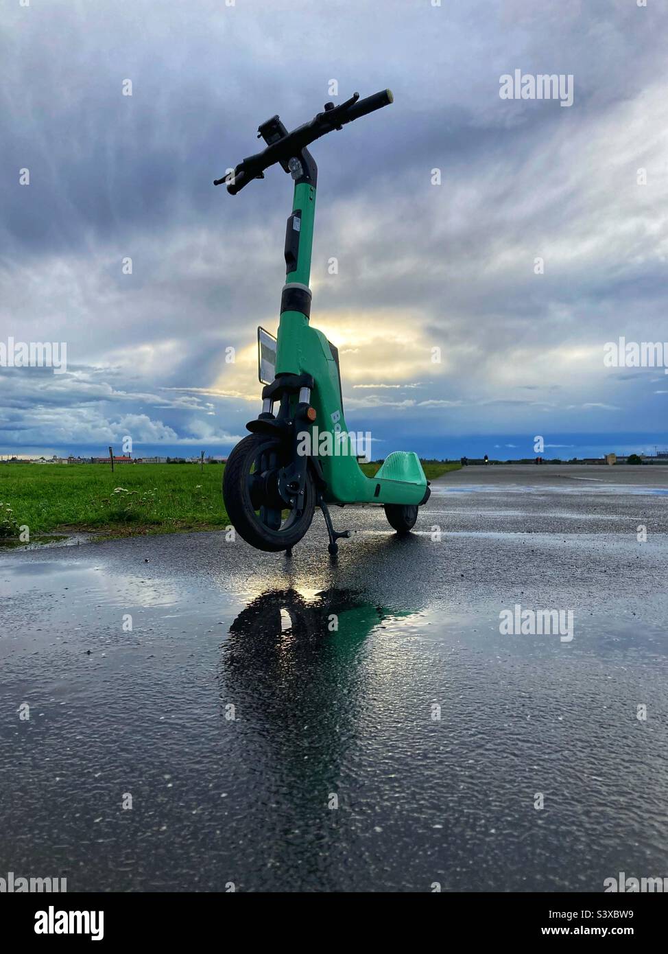 An e scooter Belonging to the Company Bolt on the Former airport Tempelhof on a Rainy day, Berlin, Germany - Smartphone Captured Stock Image