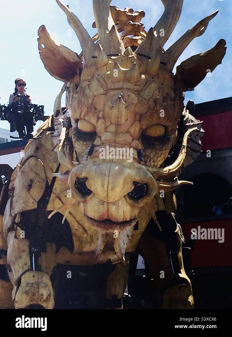 Up close with Long Ma, a fire-breathing mechanized dragon sculpture from the La Machine group. - Smartphone Captured Stock Image