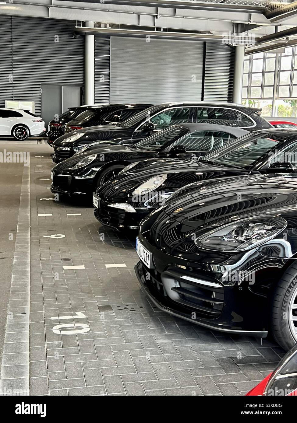 Porsche dealership in Germany with black cars Stock Photo Alamy
