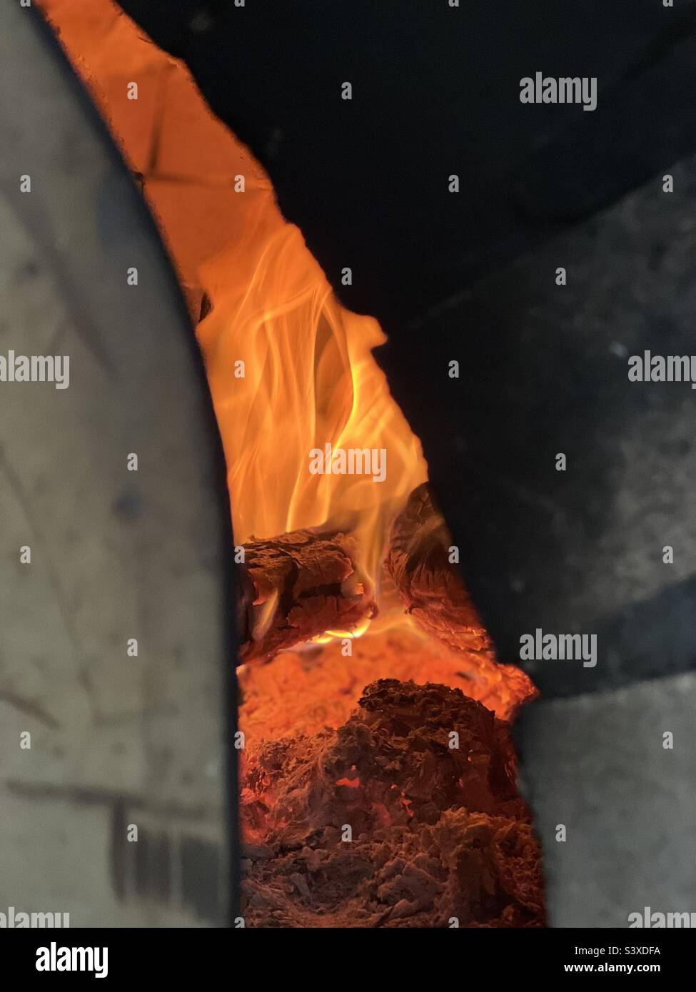 Fire in brick oven Stock Photo