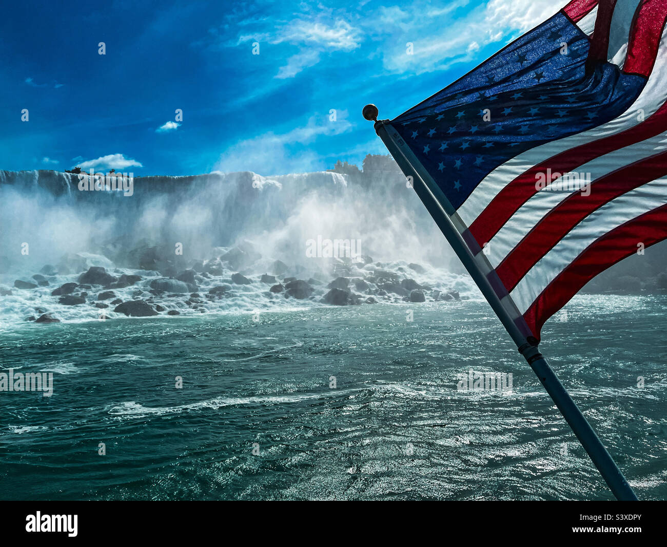 Niagara Falls with American flag in foreground - Smartphone Captured Stock Image