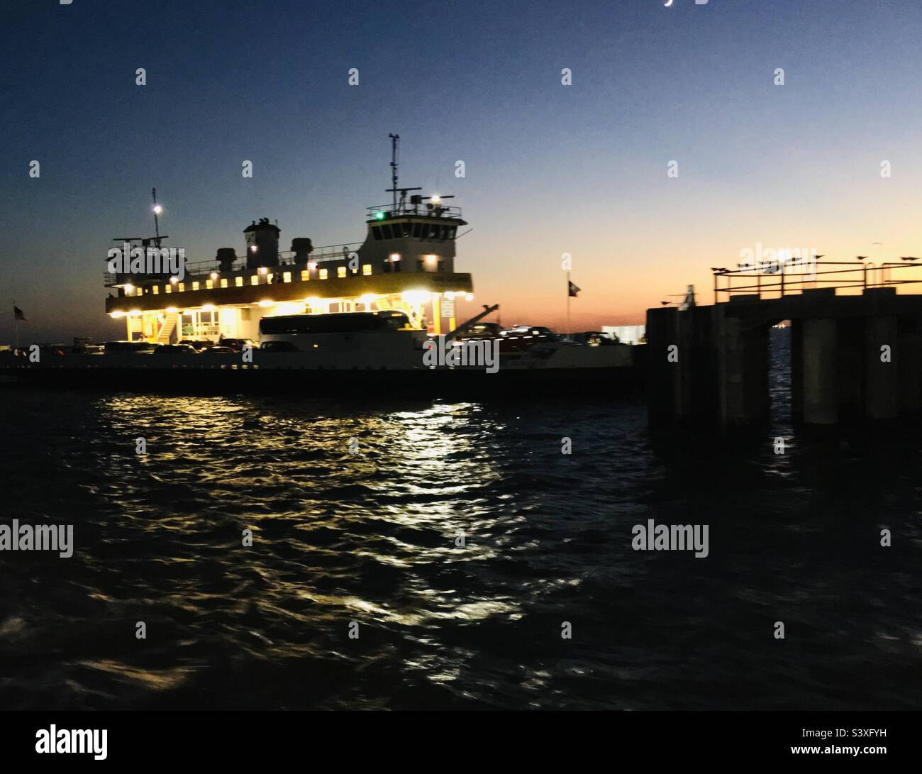 Night Ferry Crossing at Bolivar Peninsula and Galveston, Texas Stock Photo