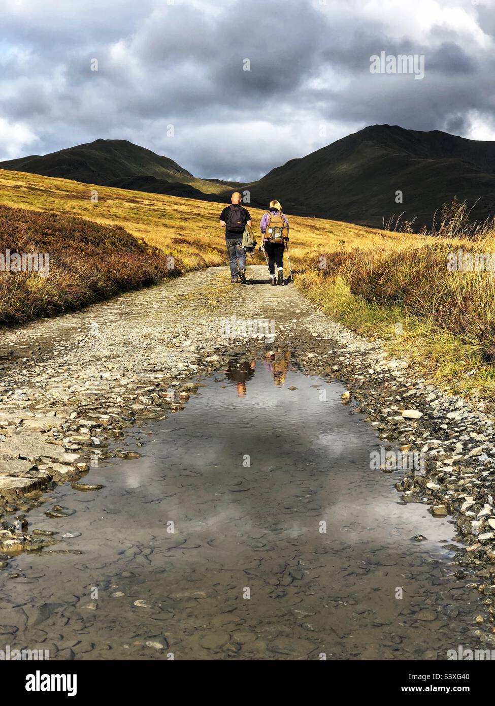 View of the Ben Lawers range and Walkers heading back to the start after a day on the hills, Killin, Scotland - Smartphone Captured Stock Image