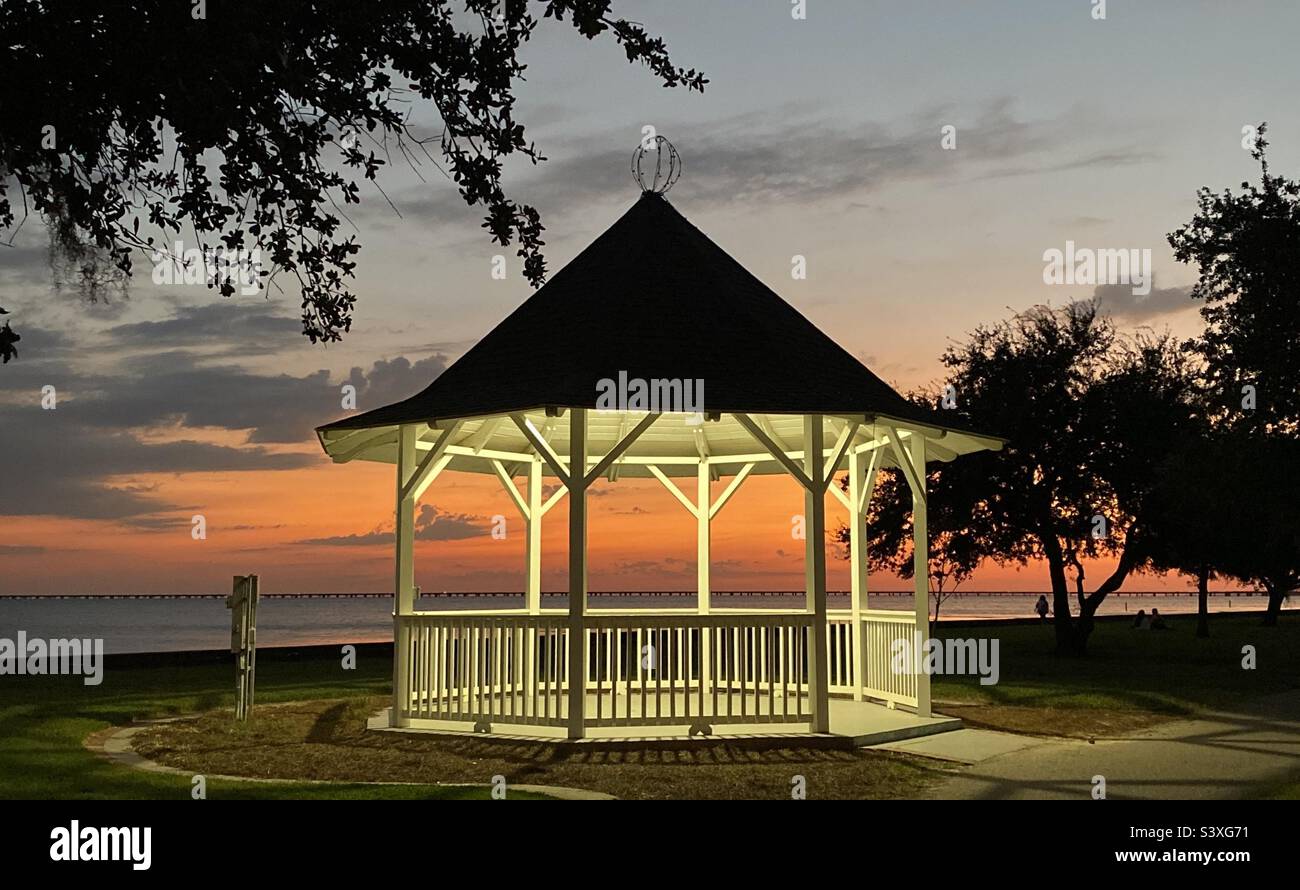 Sunset through the gazebo at the Mandeville Louisiana lakefront Stock