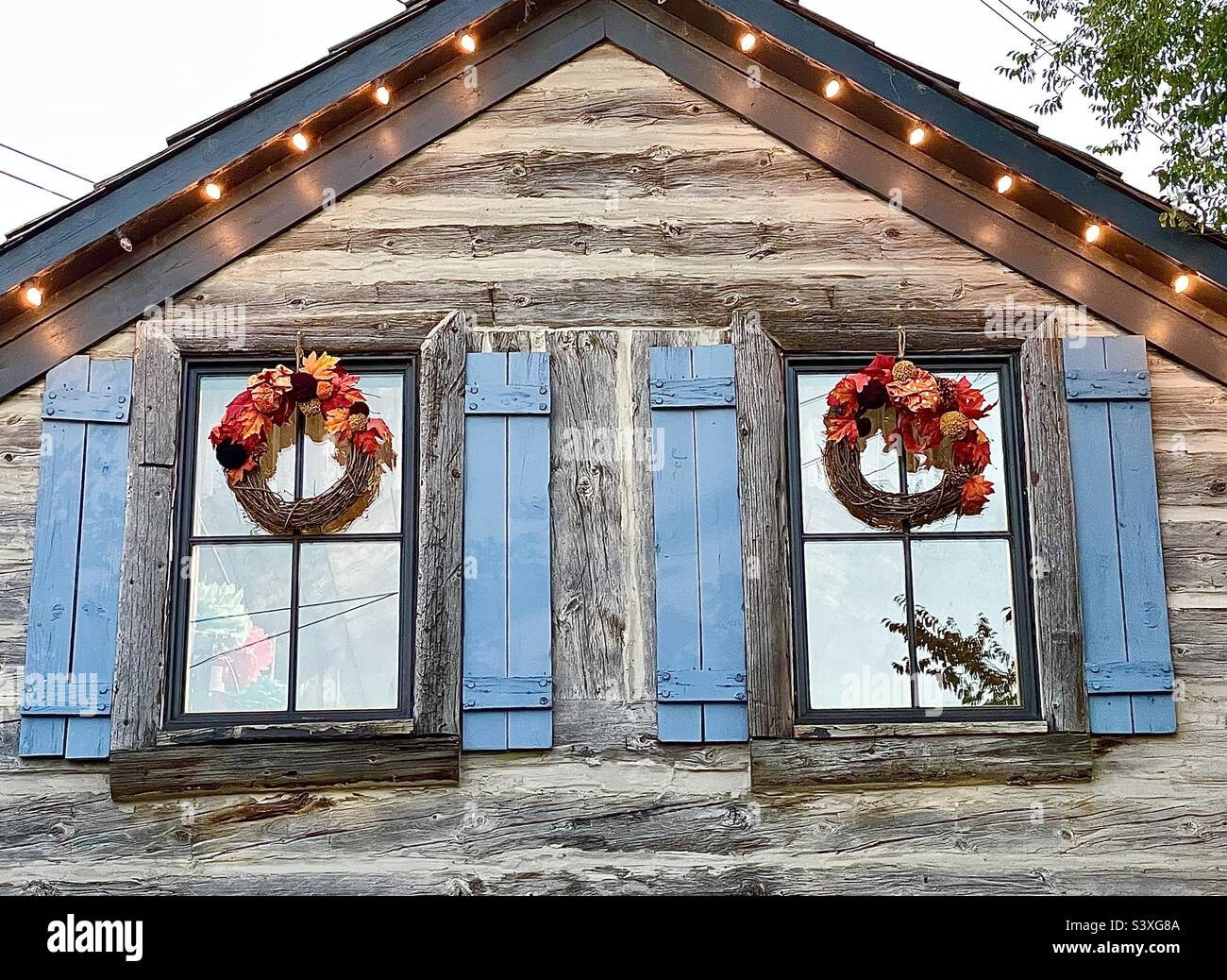 A rustic cabin building that is one of the many stores and shops within Gardner Village, a shopping and event venue. Here, this building is decorated for the upcoming Halloween season and WitchFest. - Smartphone Captured Stock Image