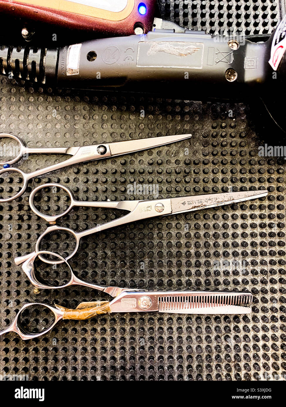 A barber’s scissors and clippers. - Smartphone Captured Stock Image