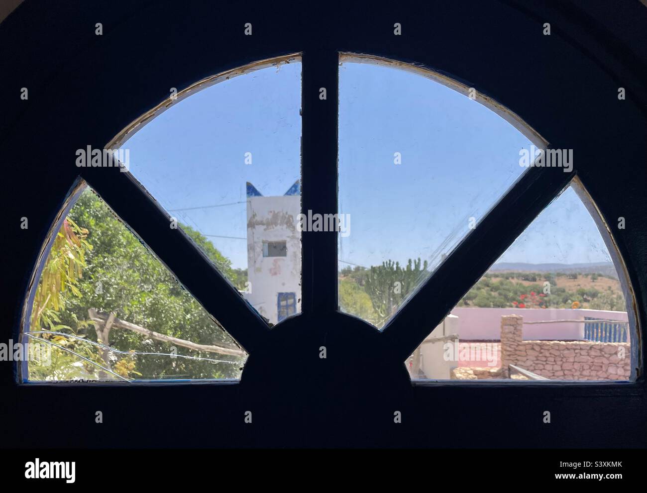 Room with a view overlooking an old minaret in the rural ms of Morocco - Smartphone Captured Stock Image