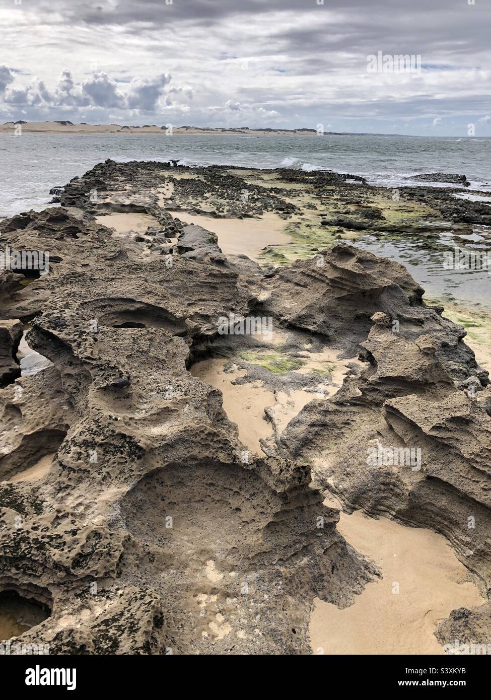 Land formation by the sea. - Smartphone Captured Stock Image