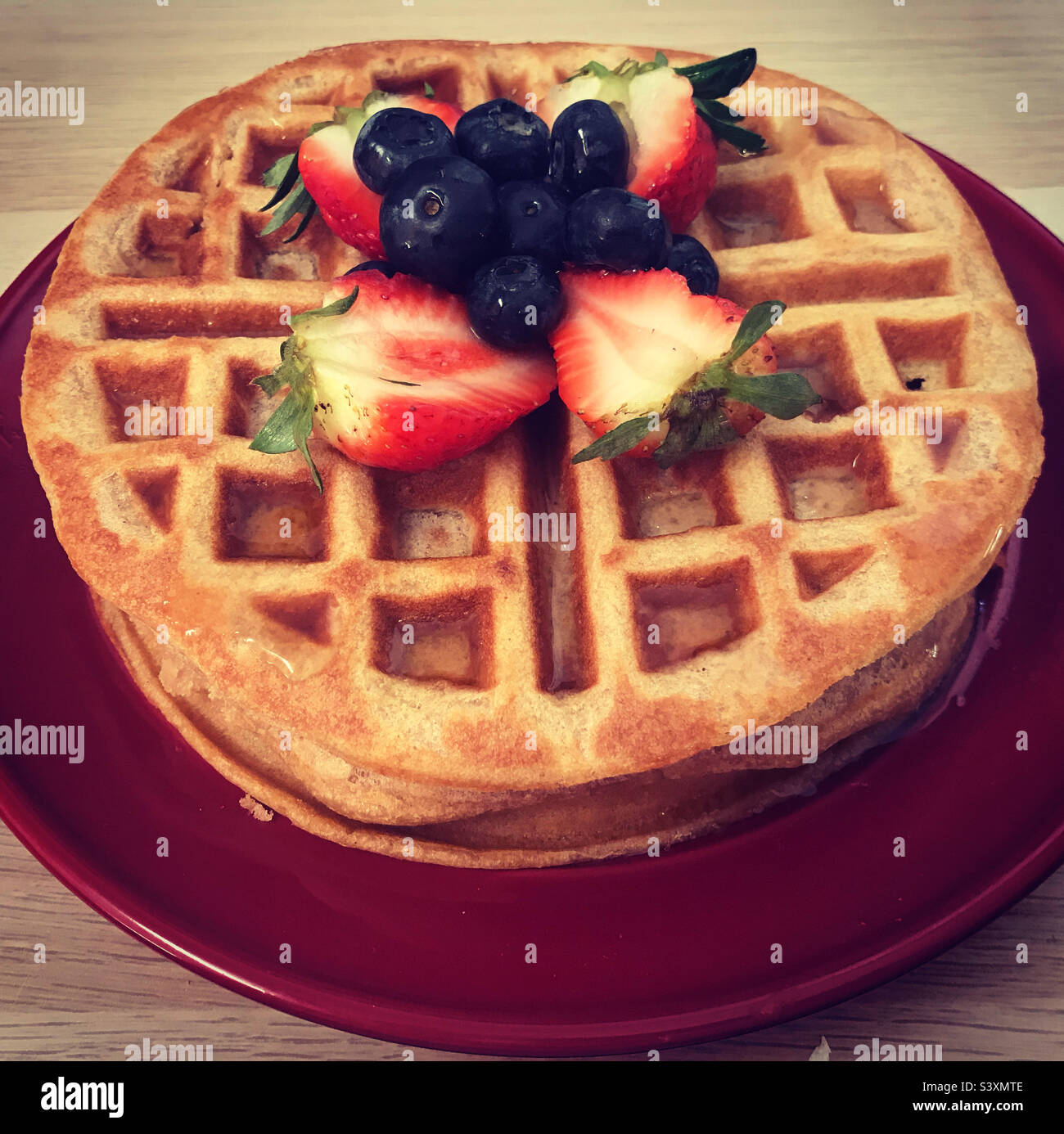 Waffles breakfast strawberry blueberry maple syrup Stock Photo Alamy