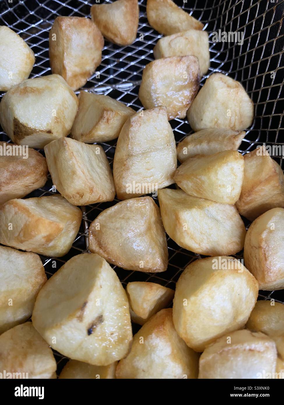 Mini Spuds in a Fryer basket - Smartphone Captured Stock Image