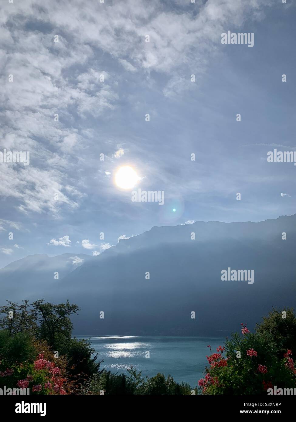 Sun beaming over Lake Brienz, Switzerland Stock Photo
