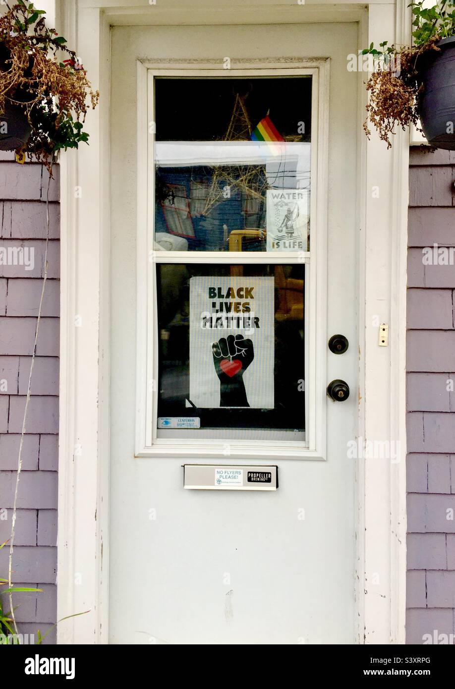 BLM and LGBTQ symbols on a door, Nova Scotia, Canada. - Smartphone Captured Stock Image