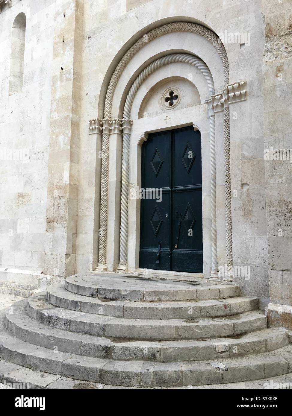 Side entrance to St Lawrence’s Cathedral (aka St John’s), Trogir, Croatia. Stock Photo