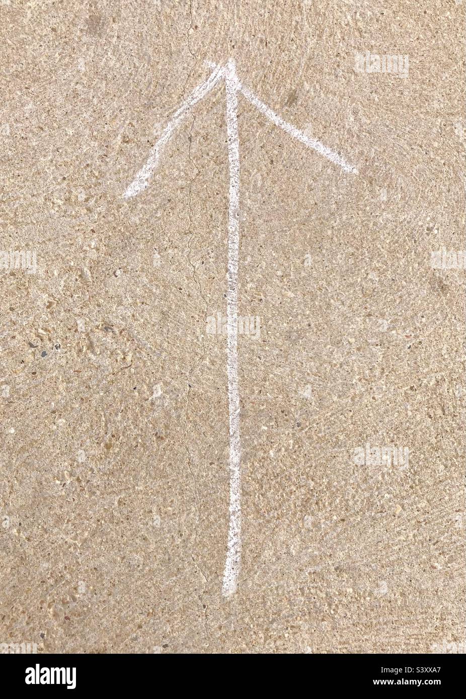 Chalk arrow drawn on concrete Stock Photo Alamy