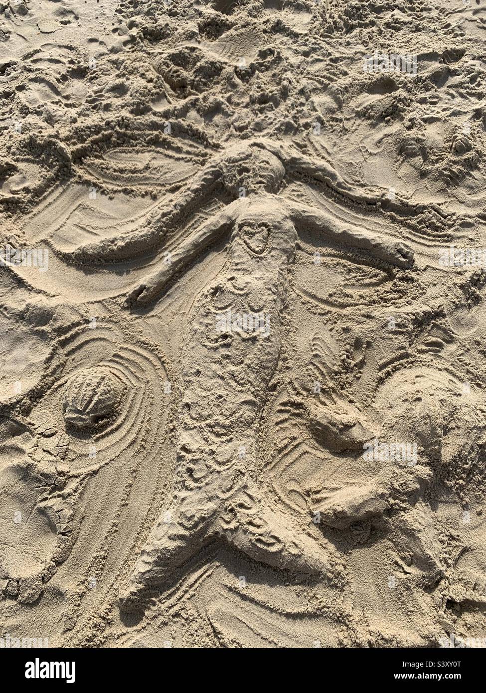 Mermaid on the beach made of sand Stock Photo