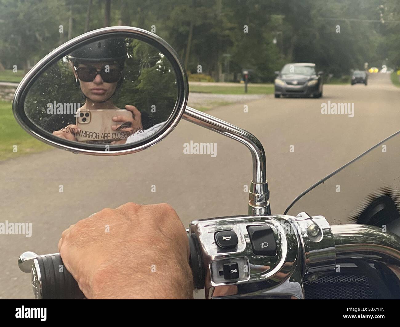 Woman in motorcycle mirror hi-res stock photography and images - Alamy