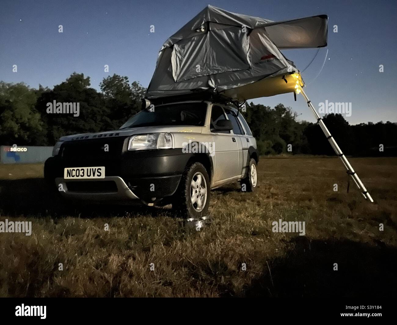 Camping in a Land Rover Freelander with a roof top tent on it Stock Photo