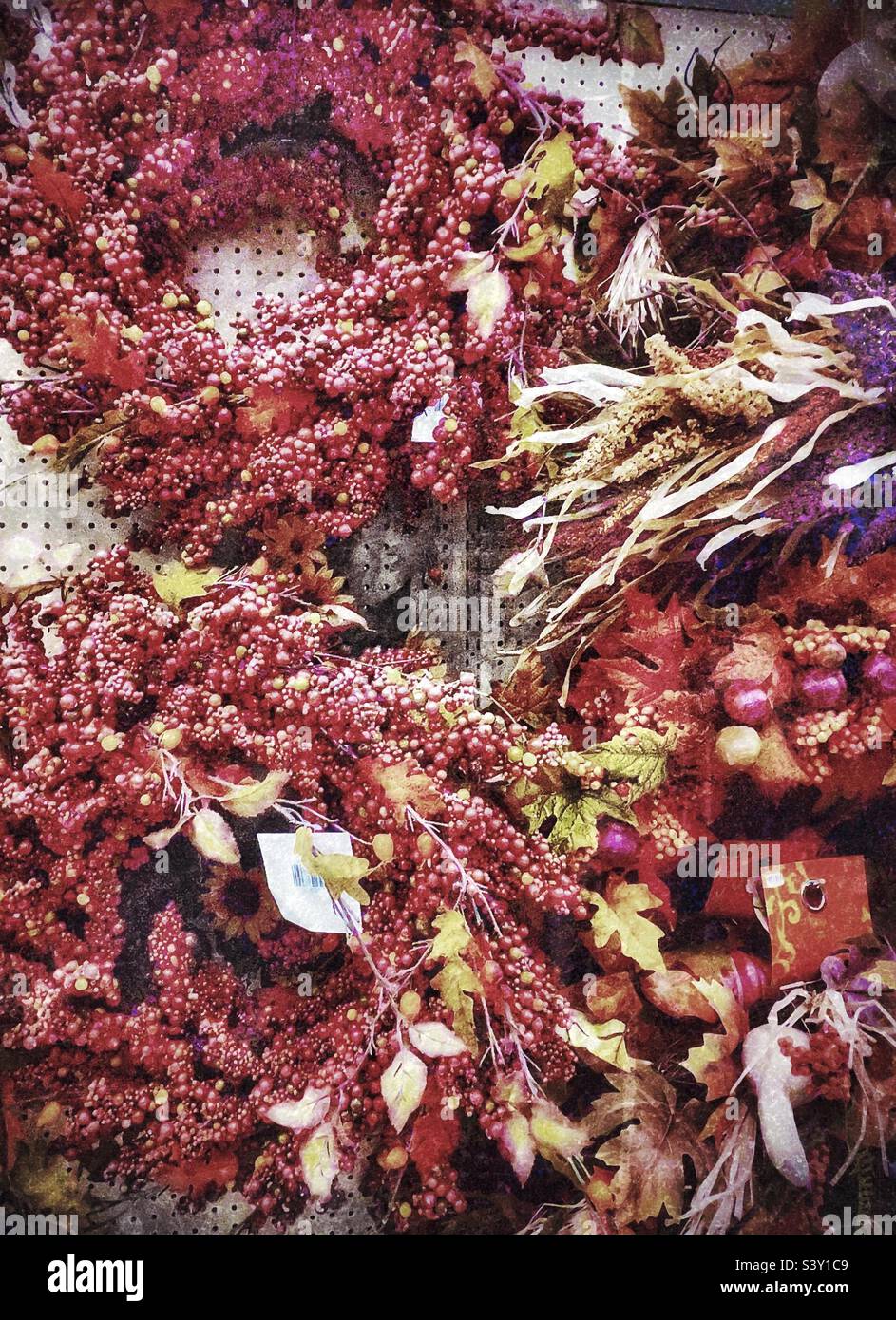 Beautifully colorful and designed autumnal floral pieces are displayed for home decor needs at a local Utah Hobby Lobby arts and craft store. - Smartphone Captured Stock Image