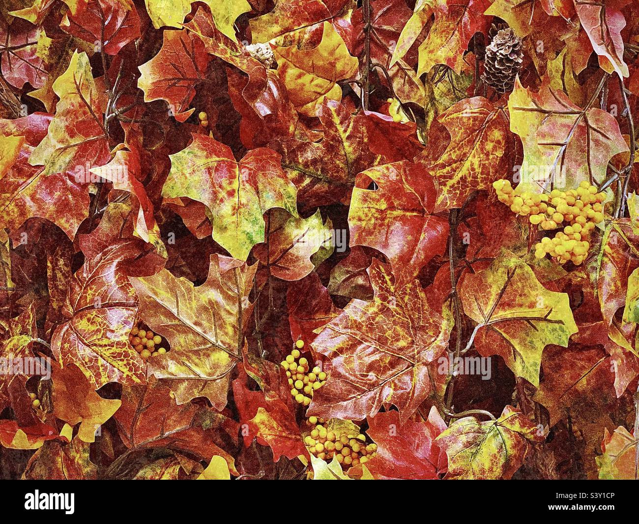 Colorfully designed and crafted autumnal products are displayed for home decor needs at a local Utah Hobby Lobby arts and craft store, like these vibrant, realistic looking autumn leaves. - Smartphone Captured Stock Image