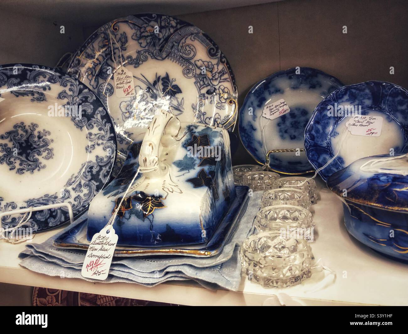 Flow blue pottery at antique mall - Smartphone Captured Stock Image
