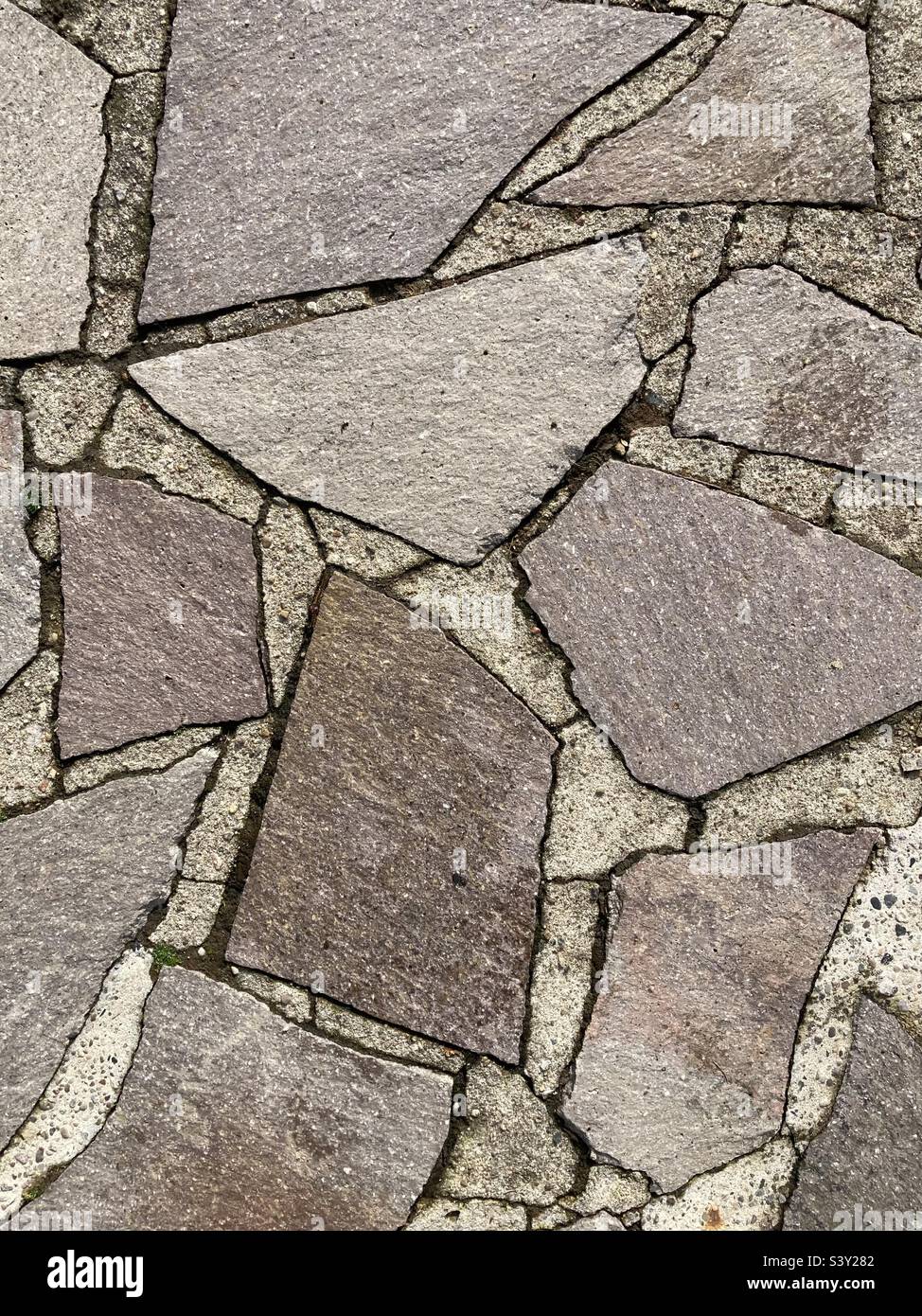 close up of floor covering made of irregular stones - Smartphone Captured Stock Image