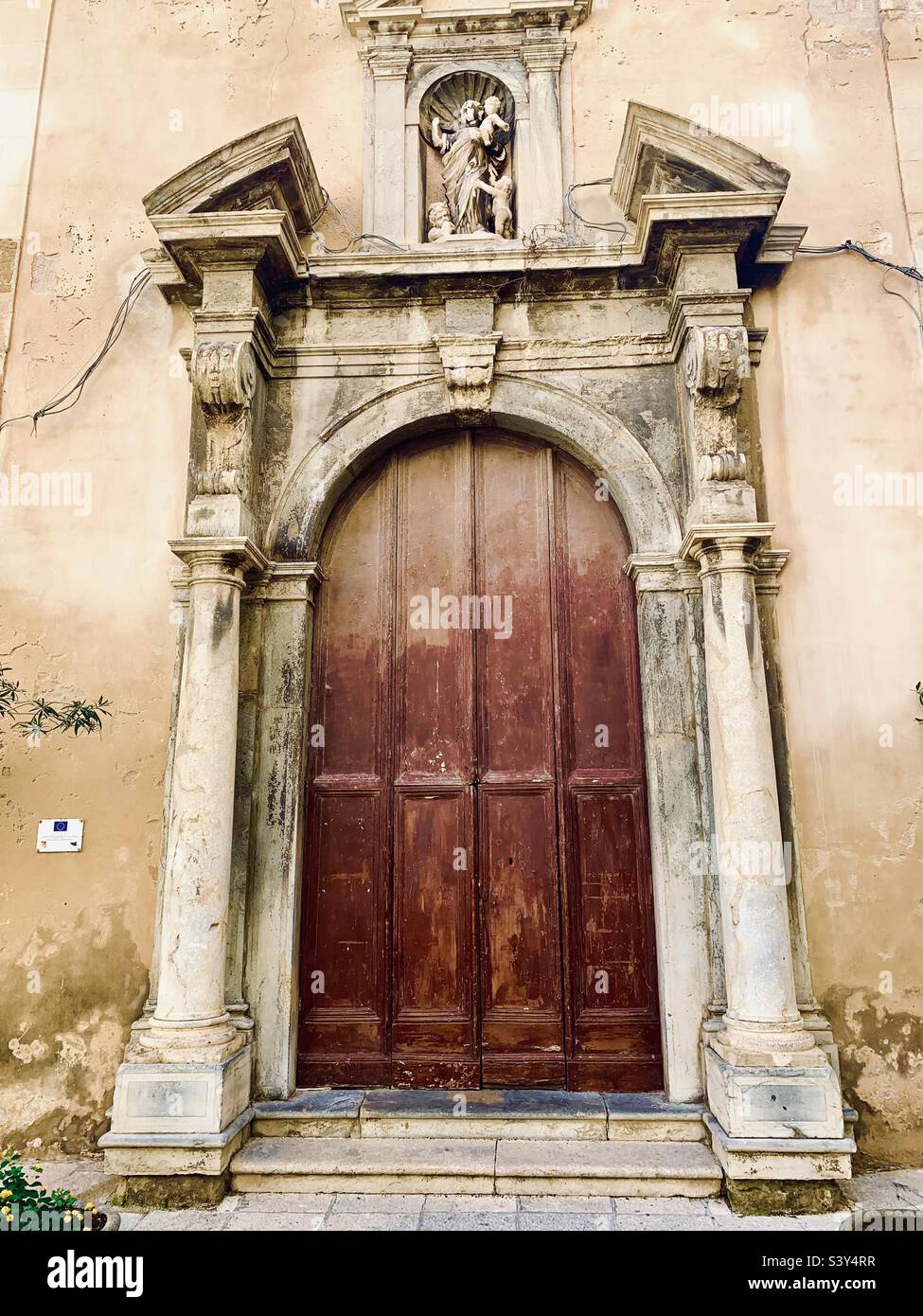 Entrance doorway to the Church of S Maria del Soccorso, Trapani, Sicily, Italy. - Smartphone Captured Stock Image