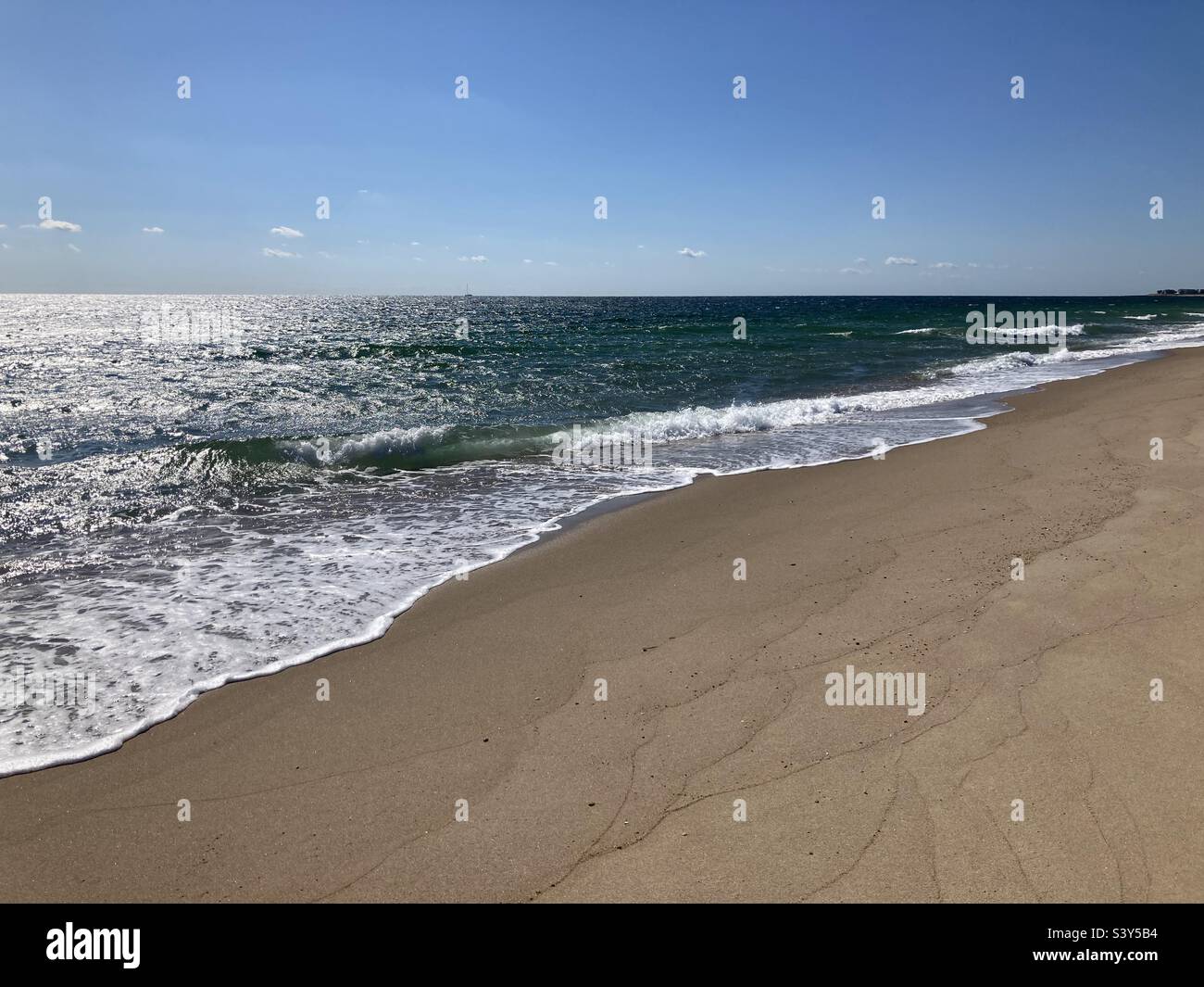 Waves and sand at a Charlestown, Rhode Island beach - Smartphone Captured Stock Image