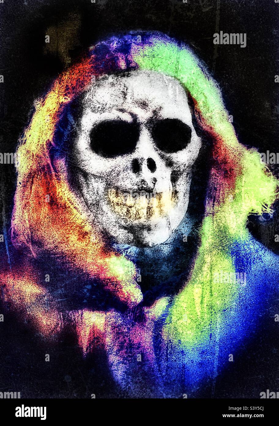 A skull-headed wraith or goblin hangs from an autumnal tree as part of a Utah, USA home owner’s yard decor as Halloween approaches. This guy likes to rock his style. - Smartphone Captured Stock Image