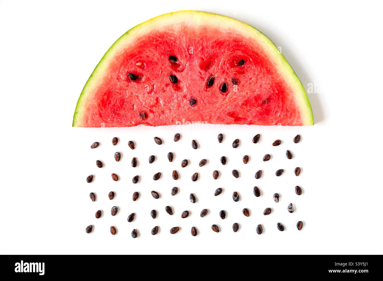 Juicy watermelon slice with seeds like a rain Stock Photo