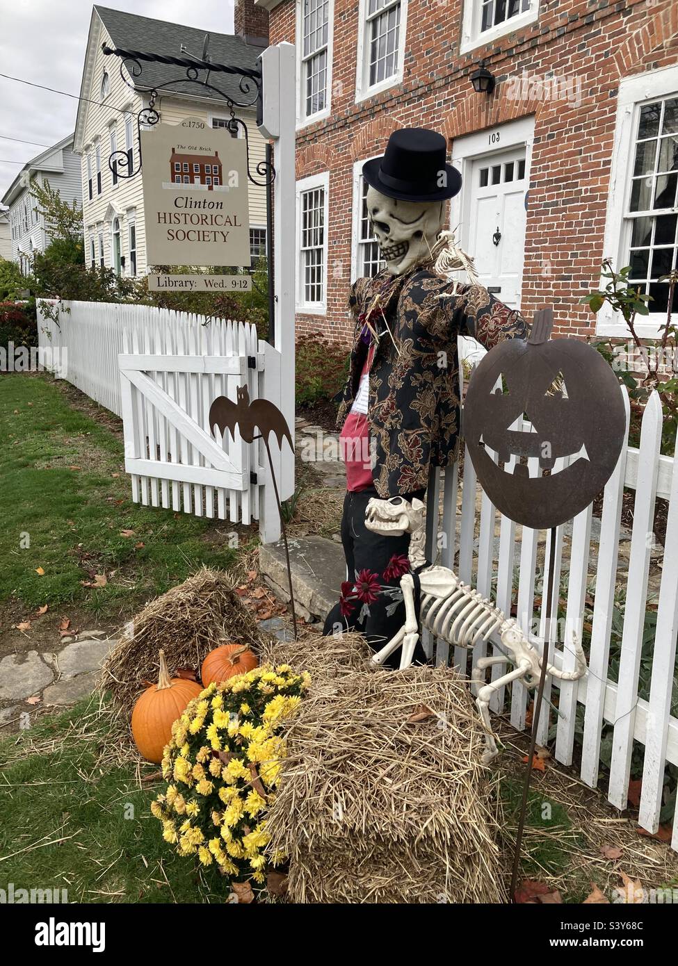 Halloween scarecrow outside of Clinton Connecticut‘s historical society building on Main Street - Smartphone Captured Stock Image
