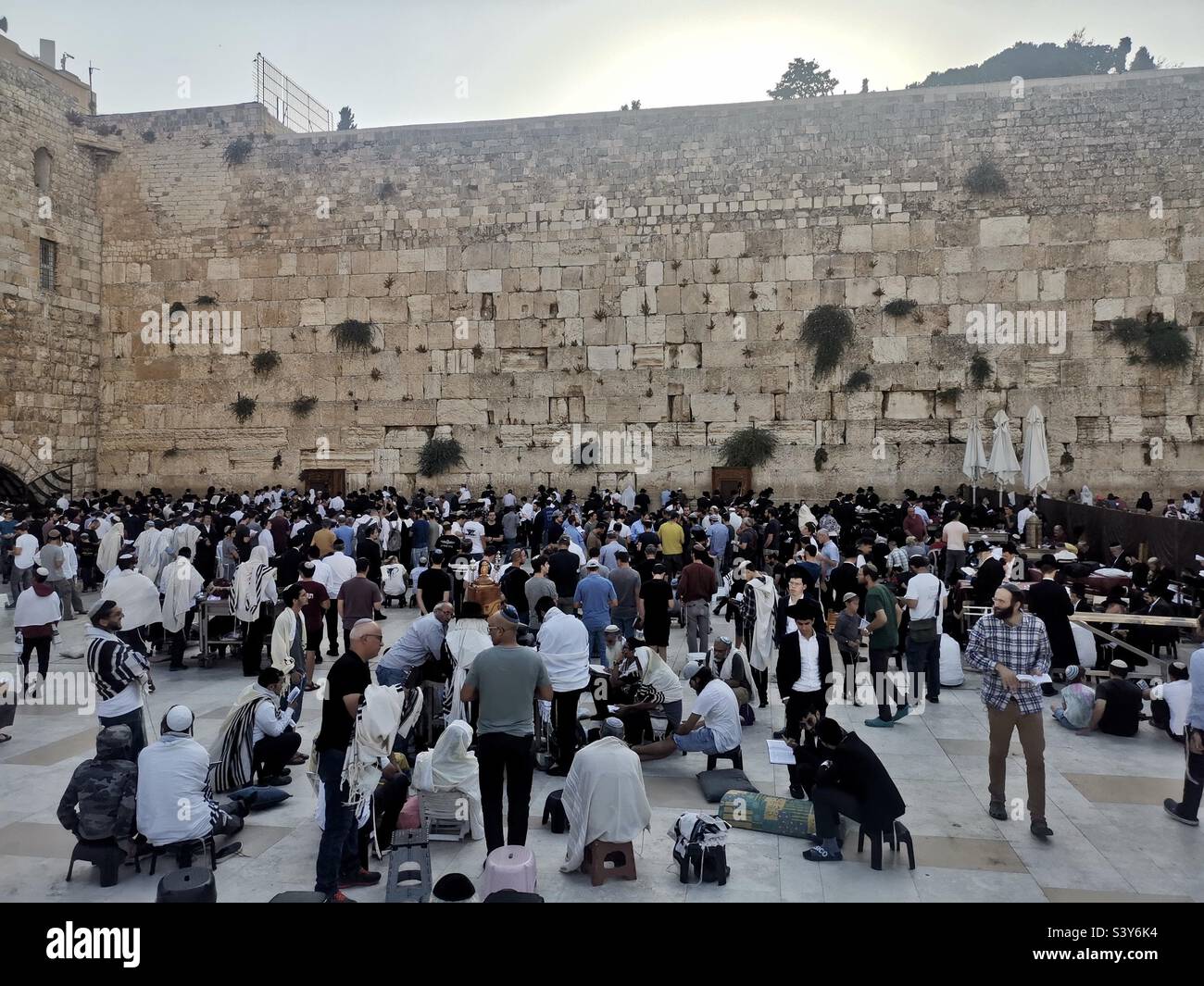 Prayers by the wailing wall in Jerusalem, Israel. - Smartphone Captured Stock Image