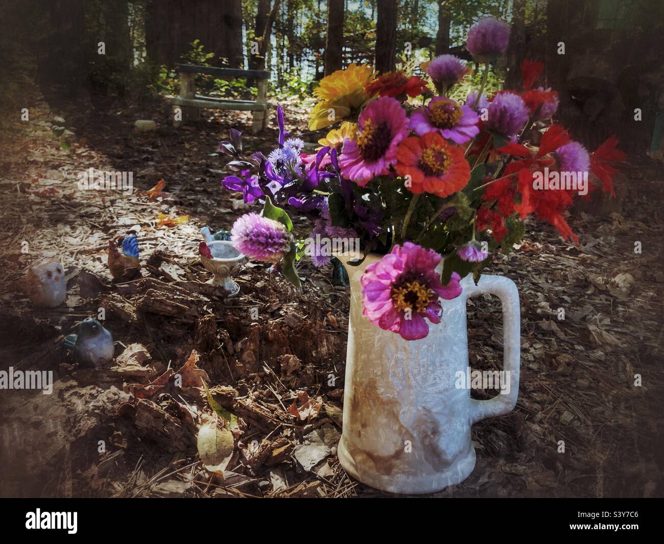 Grunge photo of end-of season garden flowers in a white pitcher - Smartphone Captured Stock Image