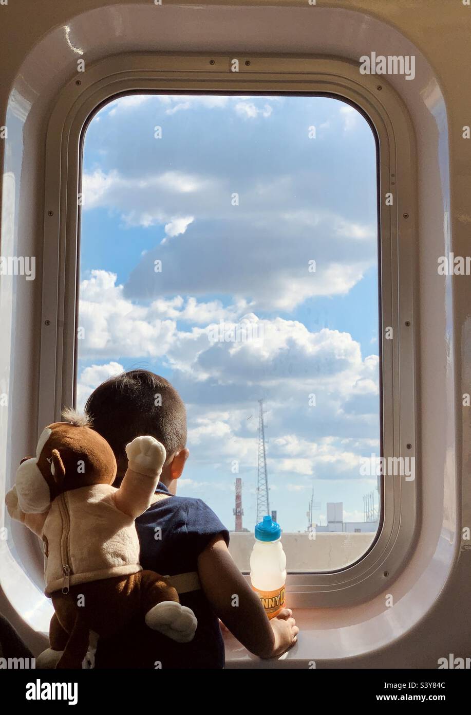 A boy looking at the window - Smartphone Captured Stock Image