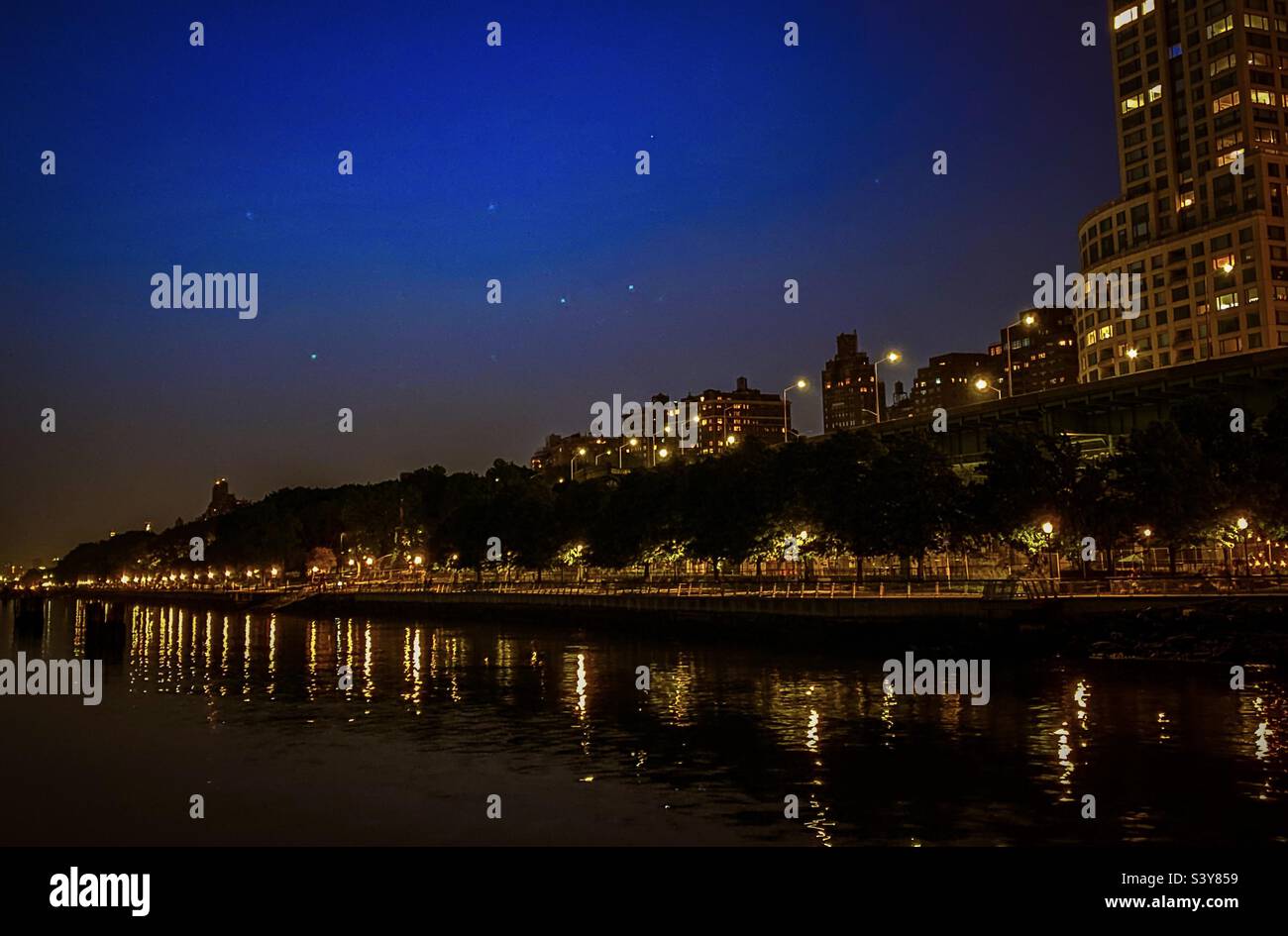 Reflection of the buildings, riverside park New York - Smartphone Captured Stock Image