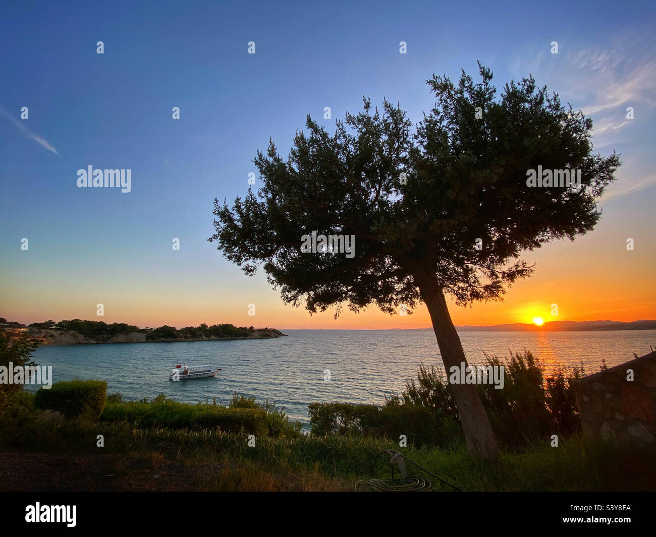 Sunset over Lardos Bay from Pefkos on island of Rhodes, Greece Stock Photo