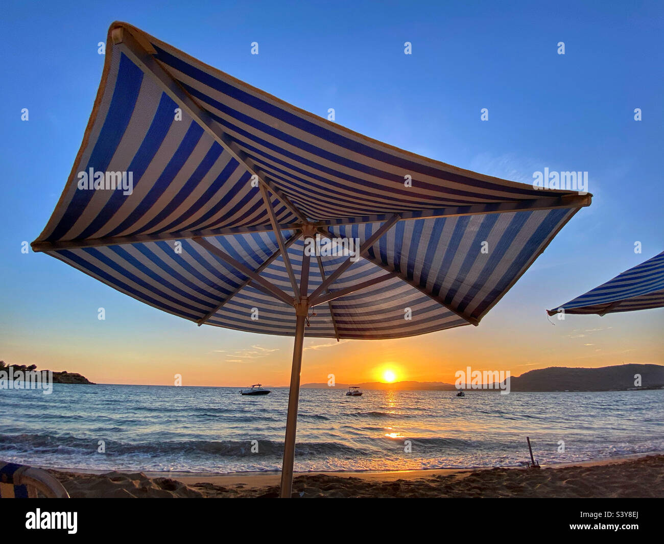 Sunset over Lardos Bay from Pefkos on island of Rhodes, Greece Stock Photo